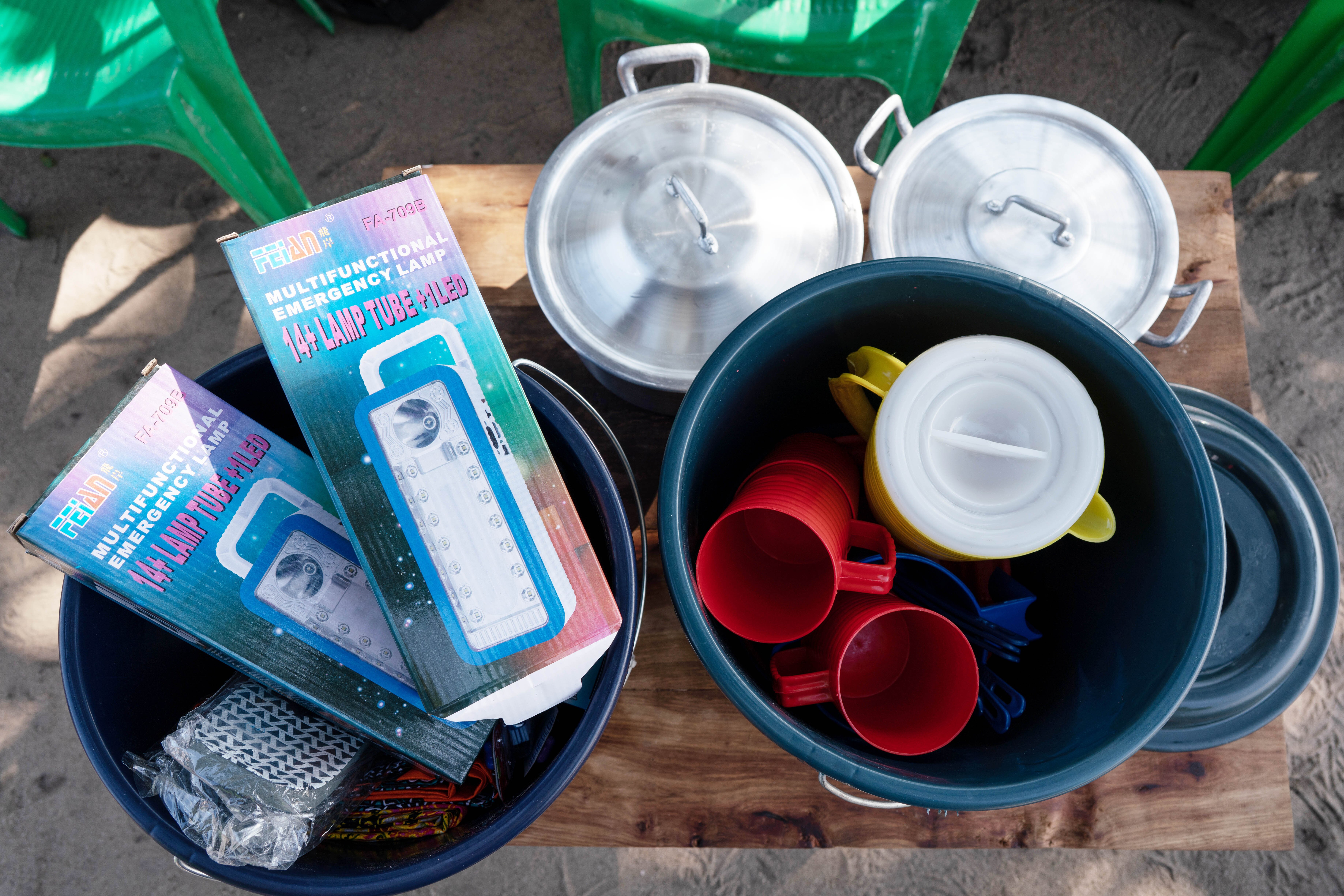 Hygiene kit items, e.g. lamp, pots, jugs, buckets